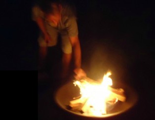 enjoy your backyard fire pit with these easy homemade firestarters, outdoor living, A couple of the firestarters in the pit with the wood makes your fire start quickly and easily