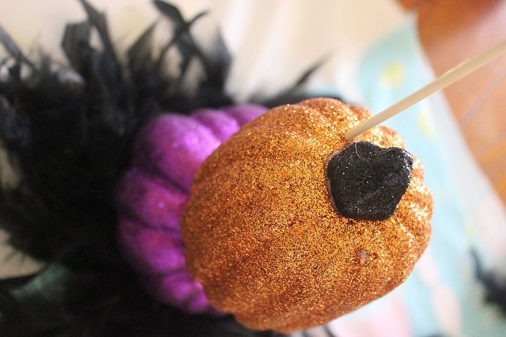 how to make topsy turvy glam pumpkins, crafts, seasonal holiday decor, Stick the wooden skewer through the top of the second pumpkin and all the way through the bottom pumpkin Snip off left over skewer Now repeat with your top pumpkin