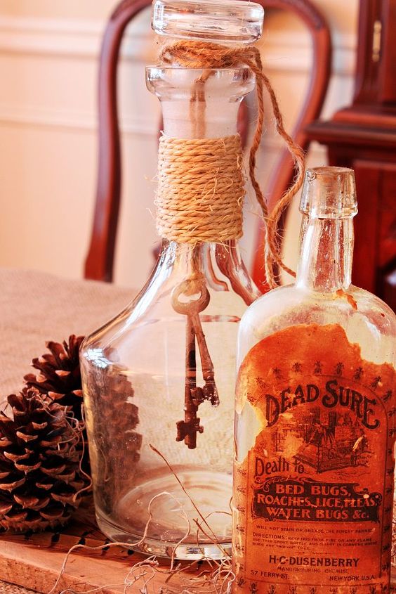 i whipped together a halloween tablescape, halloween decorations, living room ideas, seasonal holiday decor, Dead Sure found this old bottle in the basement of a house I rented a long time ago