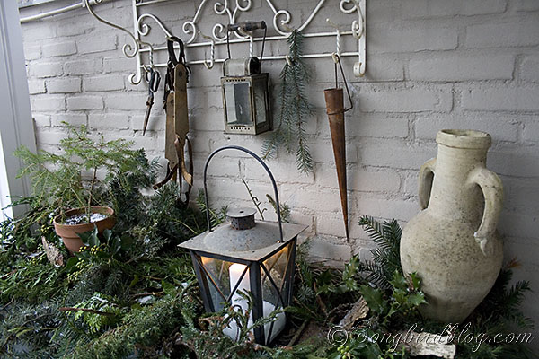 christmas outdoor decor, outdoor living, seasonal holiday decor, And old lantern filled with snow and a candle gives light on the dark winter evenings