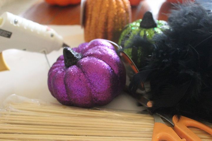 how to make topsy turvy glam pumpkins, crafts, seasonal holiday decor, You will need 3 different shaped glittery foam pumpkins a black feather boa glue gun wooden skewers and scissors