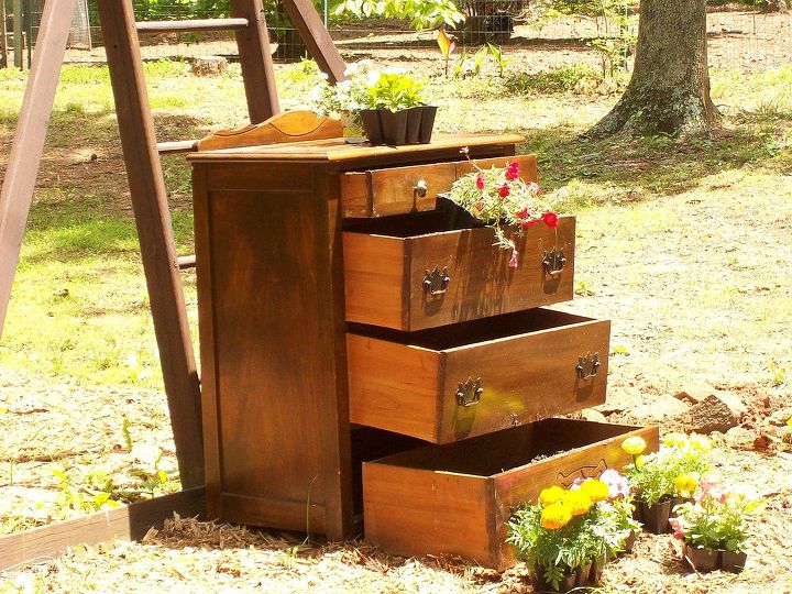 flower chest of drawers with granddaughter, flowers, gardening, repurposing upcycling, Then filled good with dirt and got to planting