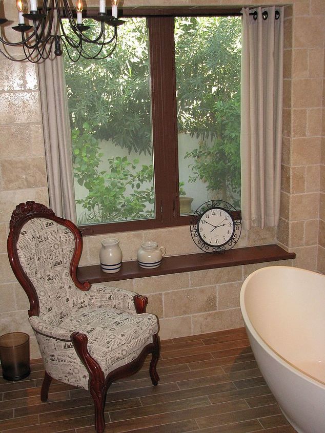 art deco master bath transforms into a spanish hacienda retreat, architecture, bathroom ideas, home decor, home improvement, We wrapped the new window with our stone wall tile and added a wood bench to add to an earthy feel
