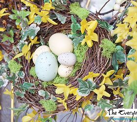 a southern porch reveal for spring 2014, curb appeal, flowers, gardening, porches, seasonal holiday decor, wreaths, A handmade birds nest filled with speckled eggs accents a forsythia wreath
