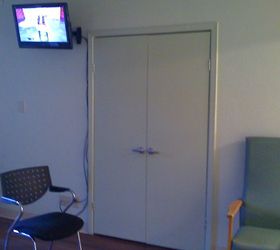 must see alzheimer secure unit nursing retirement home mural makeover, home decor, painted furniture, This supply closet was the center of attention with a little TV mounted above