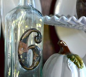 home fall tour, crafts, repurposing upcycling, seasonal holiday decor, Vintage bottle with white accent pieces in a corner cabinet