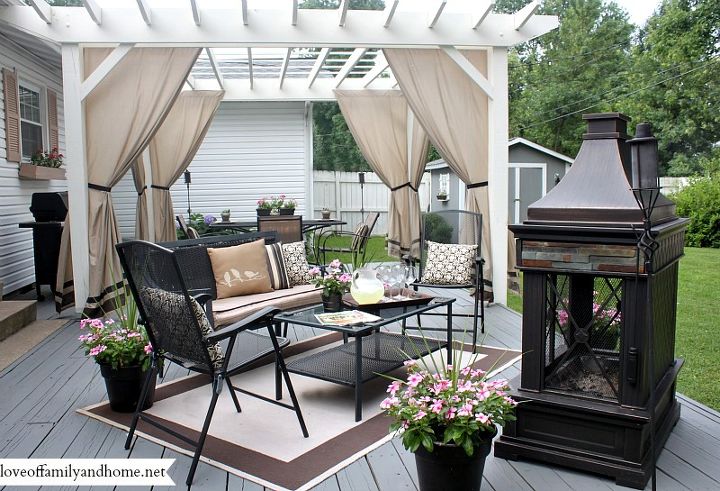 back deck makeover pergola reveal, decks, fireplaces mantels, outdoor furniture, outdoor living, painted furniture, A look at the space as a whole