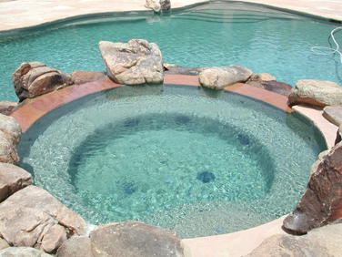 architectural details, landscape, outdoor living, pool designs, spas, Providing seating around the spa with boulders are great for frequent pool parties