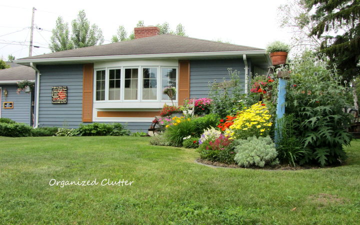 my home in 1990 and now curb appeal, curb appeal, flowers, gardening, outdoor living, I added a third paint color Terra Cotta for accent I added a perennial garden