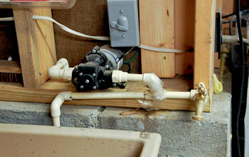 Spigot just to the right for my hose, pipe to the left feeds both sinks.
