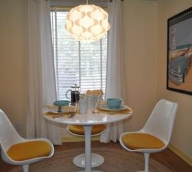 a fresh start for a breakfast nook, home decor, kitchen design, The Eero Saarinen style Tulip 30 table and four chairs with bright yellow cushions from InStyleModern com provided the centerpiece of the nook