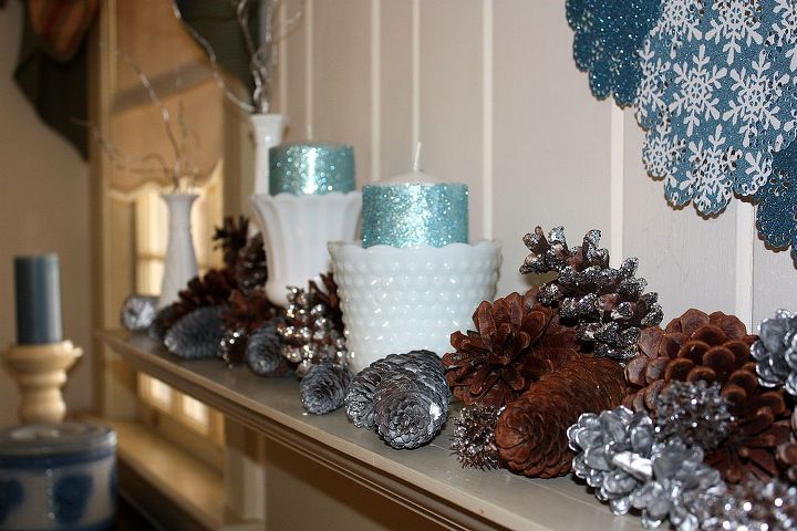 january mantel ice blue white and silver with glitter, seasonal holiday d cor, wreaths, Natural spray painted and glittered pine cones were randomly placed around the milk glass