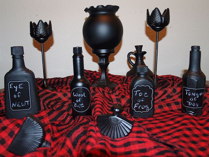 homemade halloween decor, halloween decorations, repurposing upcycling, seasonal holiday d cor, Can you tell these are Avon perfume Tabasco and McCormick Vanilla bottles and a vinegar carafe
