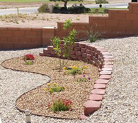 desert southwest landscaping on a small hillside circular driveway using retaining, This planting area top view shows the retaining wall we created to address the steepest area of the landscape The planting bed design shape is just something simple to add a little more character than just a circle or a square box