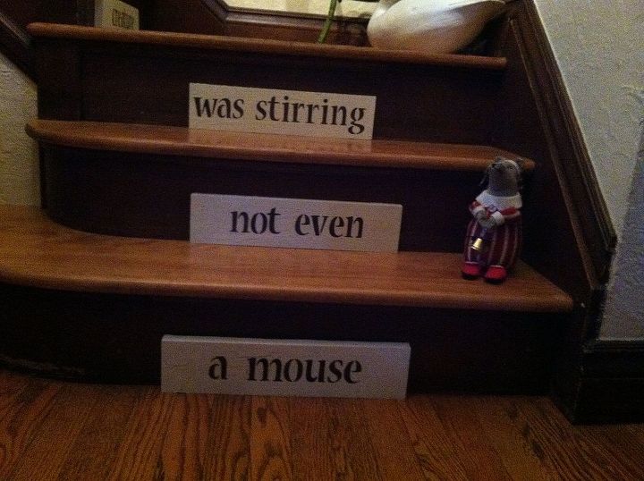 christmas stairs, christmas decorations, seasonal holiday decor, stairs, Looks like there was a mouse stirring Yikes I did straighten the wood out after I saw this photo haha
