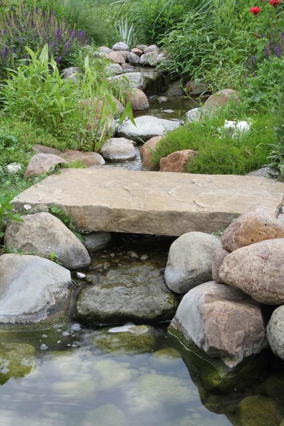 add a bridge to your pond or landscape, outdoor living, ponds water features, A simple stone bridge provides steady footing as you cross the babbling brook