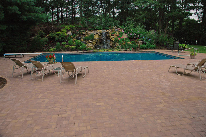 rotted retaining wall becomes and aquascape miracle project showcase how we went, decks, patio, ponds water features, pool designs, New waterfall focal point behind the swimming pool Project by Deck and Patio Company Huntington Station New York Read more