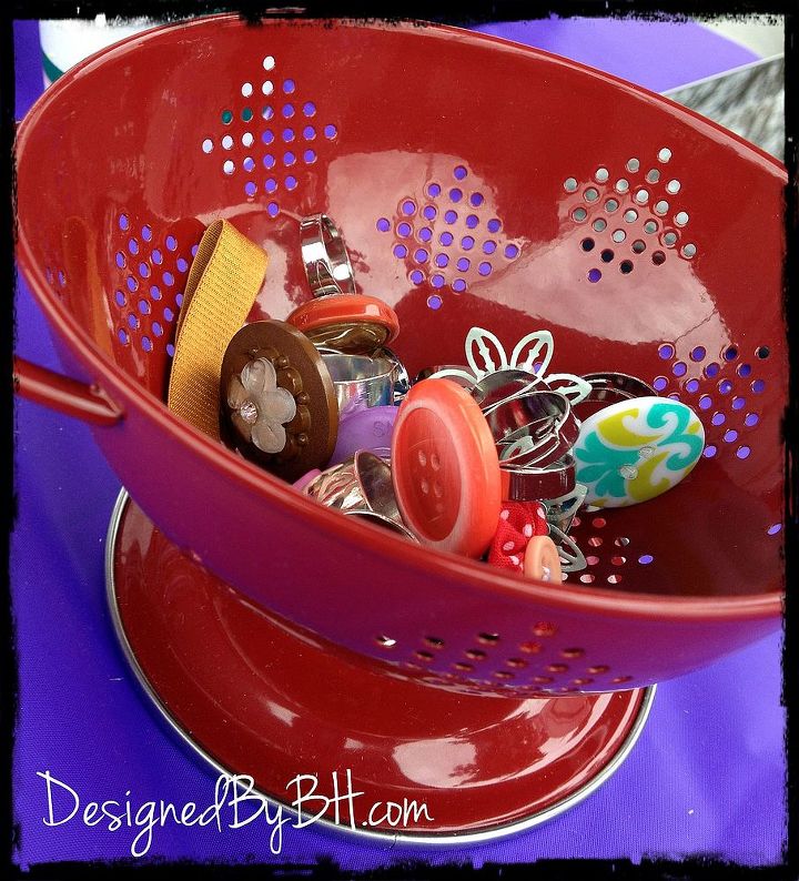 everyday item product display ideas, crafts, A small red colander used to display some of the rings I made