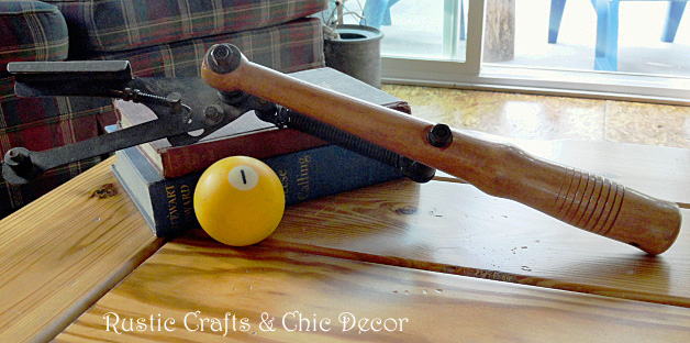 how we blended his rustic and her chic in our cabin decor, home decor, repurposing upcycling, Stacks of old books make it cozy along with antiques The bright yellow billiard ball was a fun add it for just a little whimsy