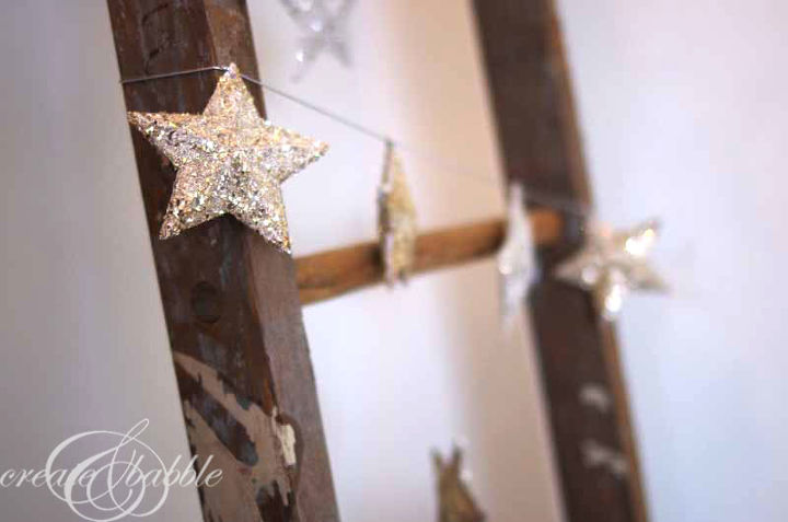 german glitter glass christmas star garland, christmas decorations, seasonal holiday decor, Then wrapped the garland around a vintage ladder