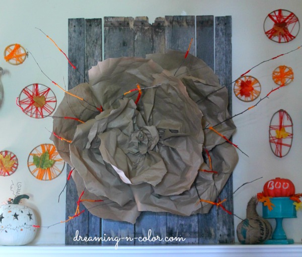 pallet art, crafts, home decor, pallet, repurposing upcycling, wrapped twigs with yarn and made a huge paper flower Stapled to board and inserted twigs It is a beautiful statement piece to the room