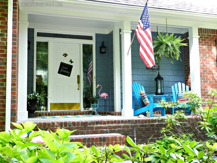 cute summer porch decorating ideas, curb appeal, seasonal holiday decor, Full view of the porch where you can see the pops of color in the flamingo chairs