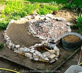 how to build a herb spiral garden, diy, flowers, gardening, homesteading, how to, perennial, Rocks are laid in a spiral design working upwards to the center and the ramp planting areas are filled with rubble soil and organic matter