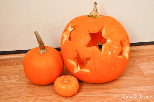 pumpkin carving with a cookie cutter, seasonal holiday decor, Pumpkin Carved with Cookie Cutters