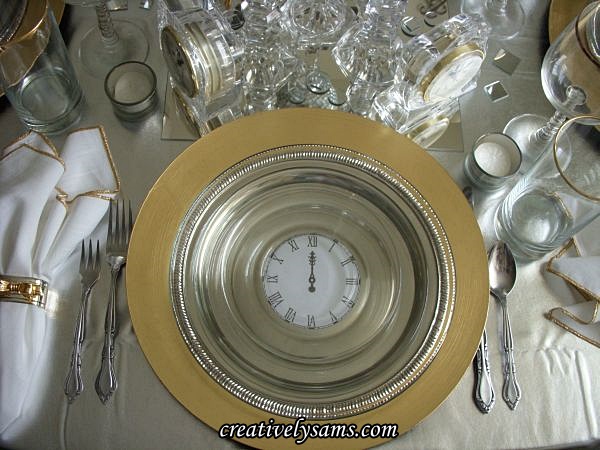 new year s tablescape, seasonal holiday decor, I wanted a plate with a clock that said midnight but I didn t have one so I went online found a clock face clip art enlarged it to 4 wide printed out 4 of them I cut the clock face out put it in the center of the silver tray Then I added clear plates on top of the clock face