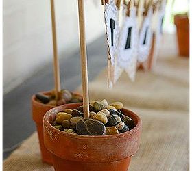 thanksgiving diy banner, crafts, seasonal holiday decor, thanksgiving decorations, Use sand and smooth river rock to stabalize the small terra cotta pots that hold your banner