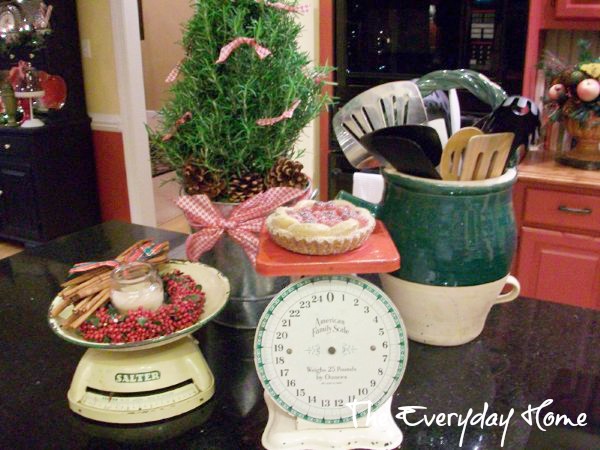 a southern kitchen with red painted cabinets perfect setting for christmas, christmas decorations, seasonal holiday decor, Vintage kitchen scales and a pretty rosemary topiary