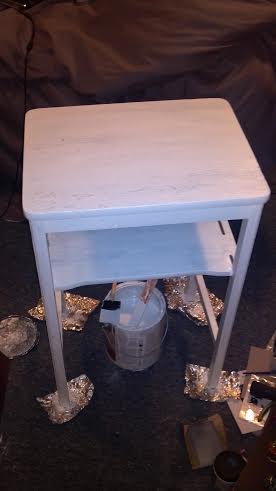 side table redo, painted furniture, this is acually after primer coat i cant find my before photo it was old beat up wood with broken wood decoration where the chicken wire now is used thin trim to cover holes and wire edging