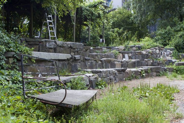discovering the community gardens with manhattan sideways, flowers, gardening, urban living, This outdoor theater and community garden has a stone stage a covered sand pit shady benches a wooden gazebo and a wildlife habitat