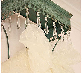 creating a cheap bed crown for a little girl s bedroom, bedroom ideas, crafts, home decor, This is a metal shelf I found at the craft store It was perfect I purchased white tulle and an off white sheer fabric and pulled it through the shelf wires Then I tucked the fabrics behind the headboard