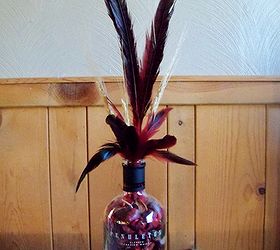 how to repupose a pendleton whiskey bottle, repurposing upcycling, filled red potpourri added red black pheasant feathers and some wheat