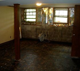 basement remodel, basement ideas, home improvement, paneling insulation everything had to go on the south wall but the cement blocks 2 layers of floor had to go too baseboards 1 4 round had to be replaced