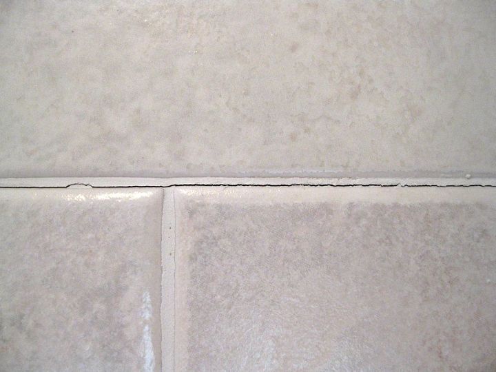 how do i repair cracked grout on shower walls