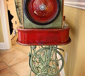 repurposed red wagon sewing machine base storage table, painted furniture, repurposing upcycling, Wheels from the Radio Flyer wagon adorn each side Repurposed Red Wagon Sewing Machine Base Storage Table by GadgetSponge