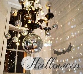 our victorian front porch decorated for halloween a diy chandelier, halloween decorations, porches, seasonal holiday decor, I used a vintage chandelier and repurposed it with mirror balls