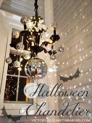 our victorian front porch decorated for halloween a diy chandelier, halloween decorations, porches, seasonal holiday decor, I used a vintage chandelier and repurposed it with mirror balls