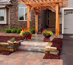 custom cedar arbor enhances home s front entrance and paver patio provides sitting, Natural stone steps and retaining wall add to the main axis of the entrance