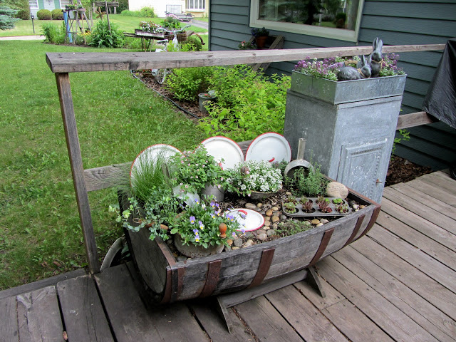 top flower junk garden posts 2012, container gardening, flowers, gardening, repurposing upcycling, succulents, In Return to the Kitchen Fairy Garden I added a fairy and shared an update on the plants