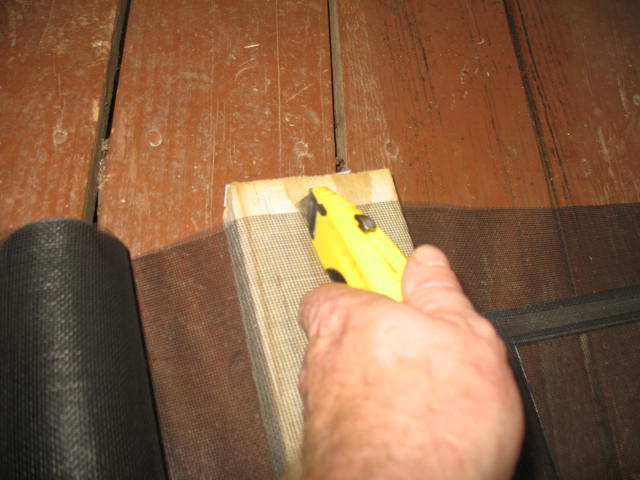 screen door repair, To avoid damaging floor use a piece of scrap wood to cut on