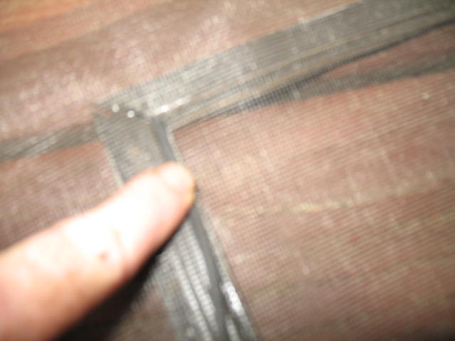 screen door repair, Using your finger first push the rubber piece on top of screen into groove