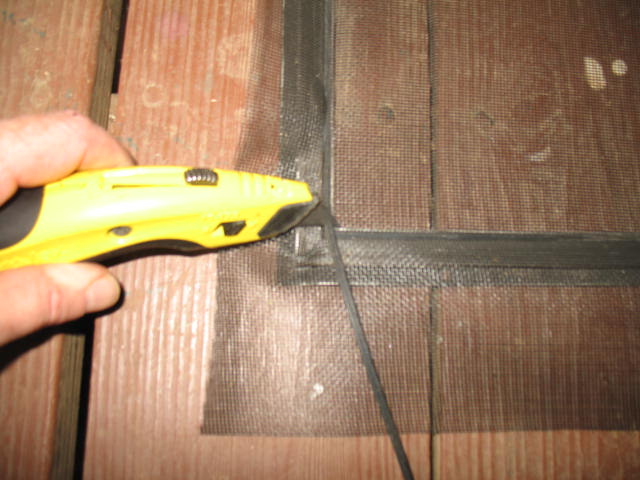 screen door repair, Very very carefully trim the rubber piece with a razor knife Be careful not to cut yourself or cut the screening that was just installed