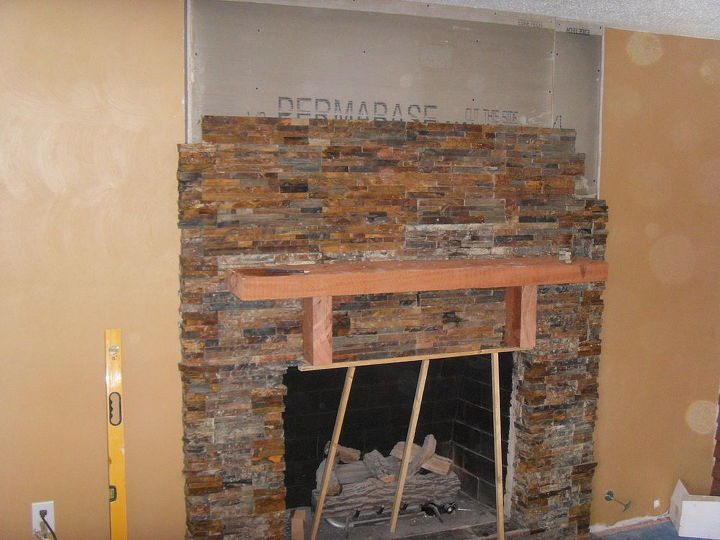 this is a stacked stone fireplace we re vamped in two and a half days this was a, concrete masonry, Had to run courses half way the first day and the rest the next day The weight can make them fall