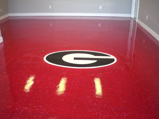 georgia fan alert this cumming ga homeowner wanted to extend his alumni pride all, basement ideas, home decor, Georgia Red floor with a Georgia logo hand painted in Epoxy