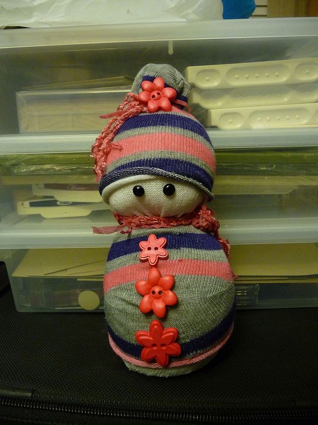 sock snowmen or snow babies as i like to call them, This one was made with a sock on the outside to make the hat and a shirt Again so many combinations with different colors and patterns of socks