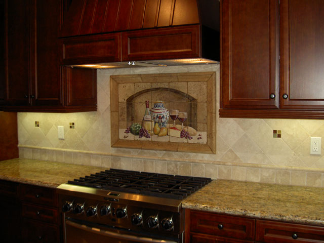 kitchen backsplash, kitchen backsplash, kitchen design, tiling, The backsplash consists of 4 and 6 torreon tumbled stone tile separated with a 1 x 12 cane stone border The colors of the mural are repeated with glass tile accents