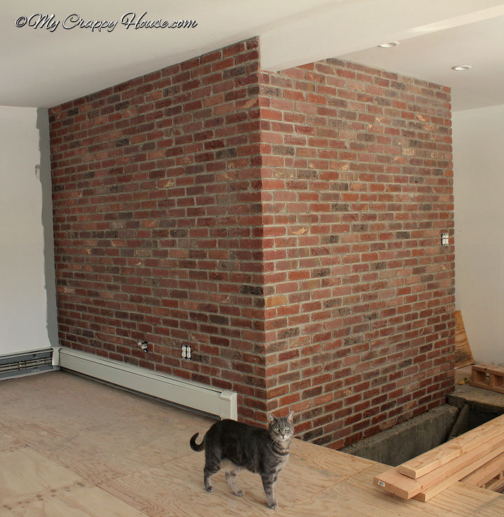 turn a plain wall into a brick wall, concrete masonry, diy, how to, wall decor, You use mortar just like a real brick wall because it IS a real brick wall just thinner I love how this turned out See more at mycrappyhouse com
